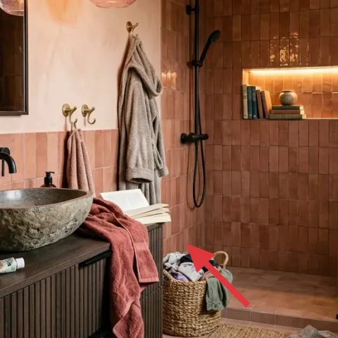 pink towel draped on vanity edge