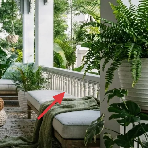 green throw blanket draped on right bench