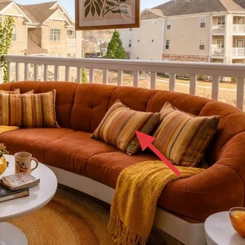 Outdoor sofa with rust cushions