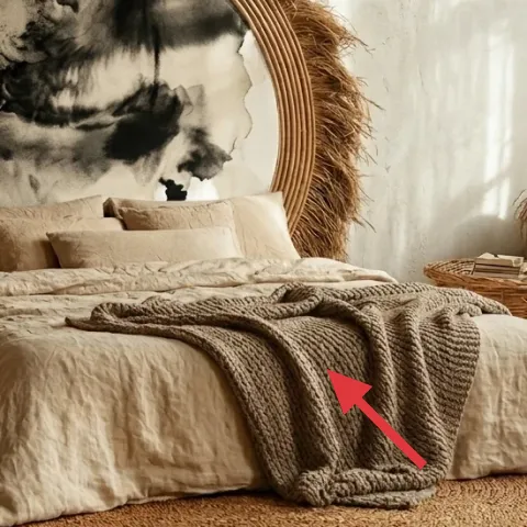 knit throw blanket draped on bed