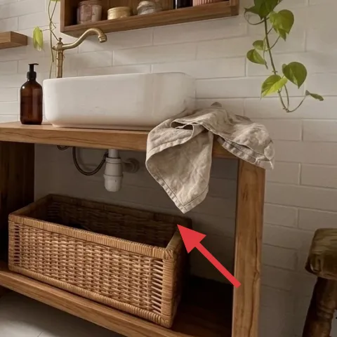 Wood vanity with open lower shelf