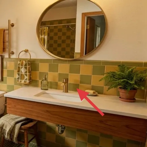 glass soap dispenser on vanity