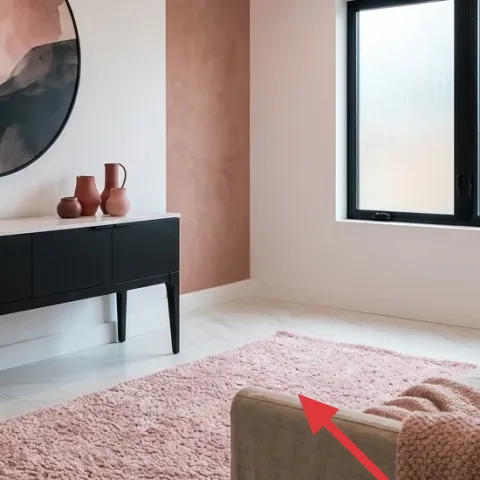 pink textured area rug