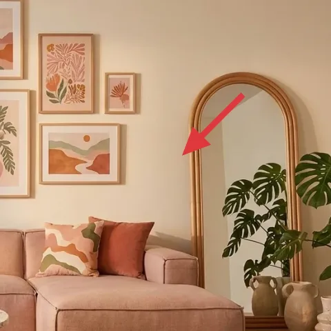 arched wall mirror with gold-toned frame